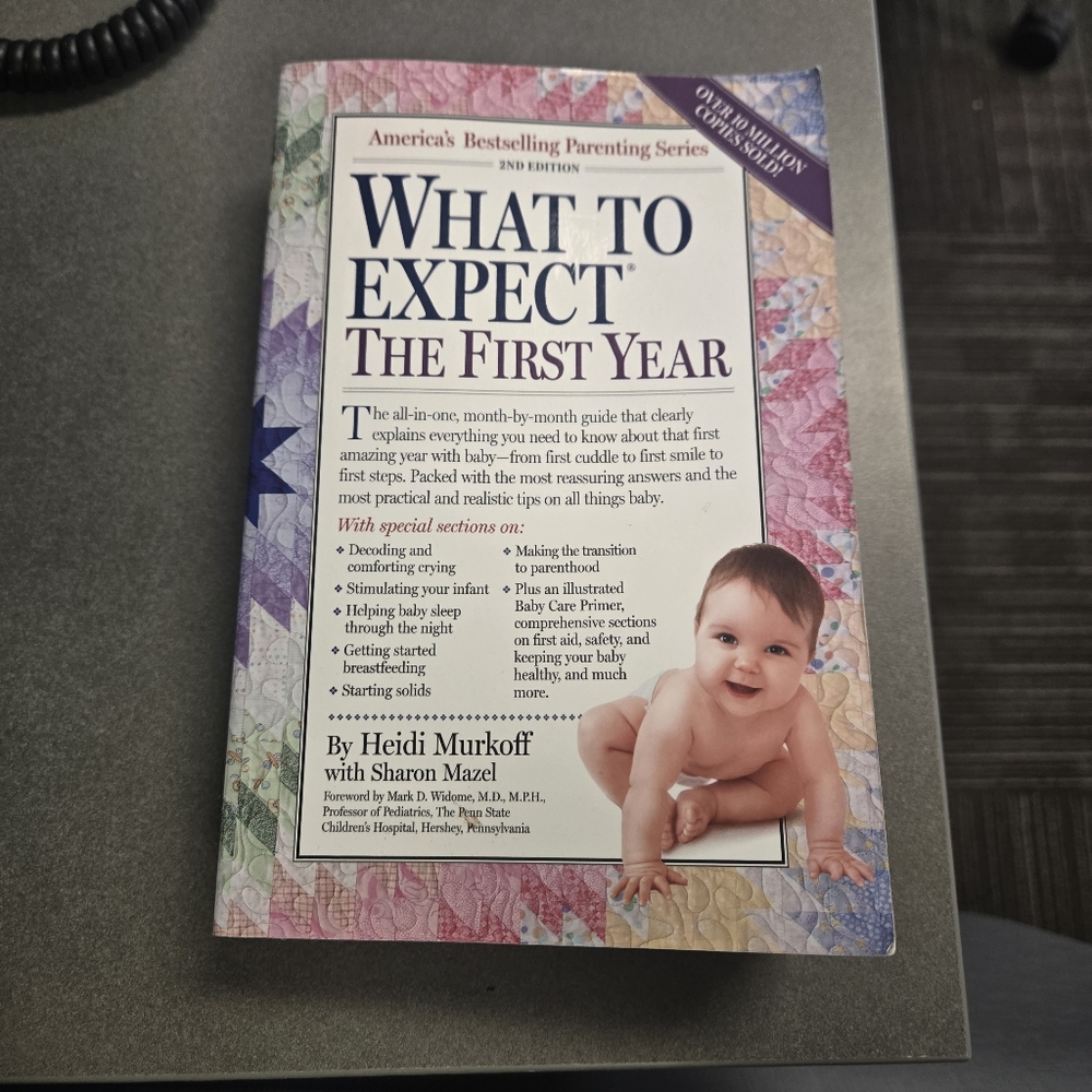 What to Expect The First Year Baby Book Reading Mother Read
